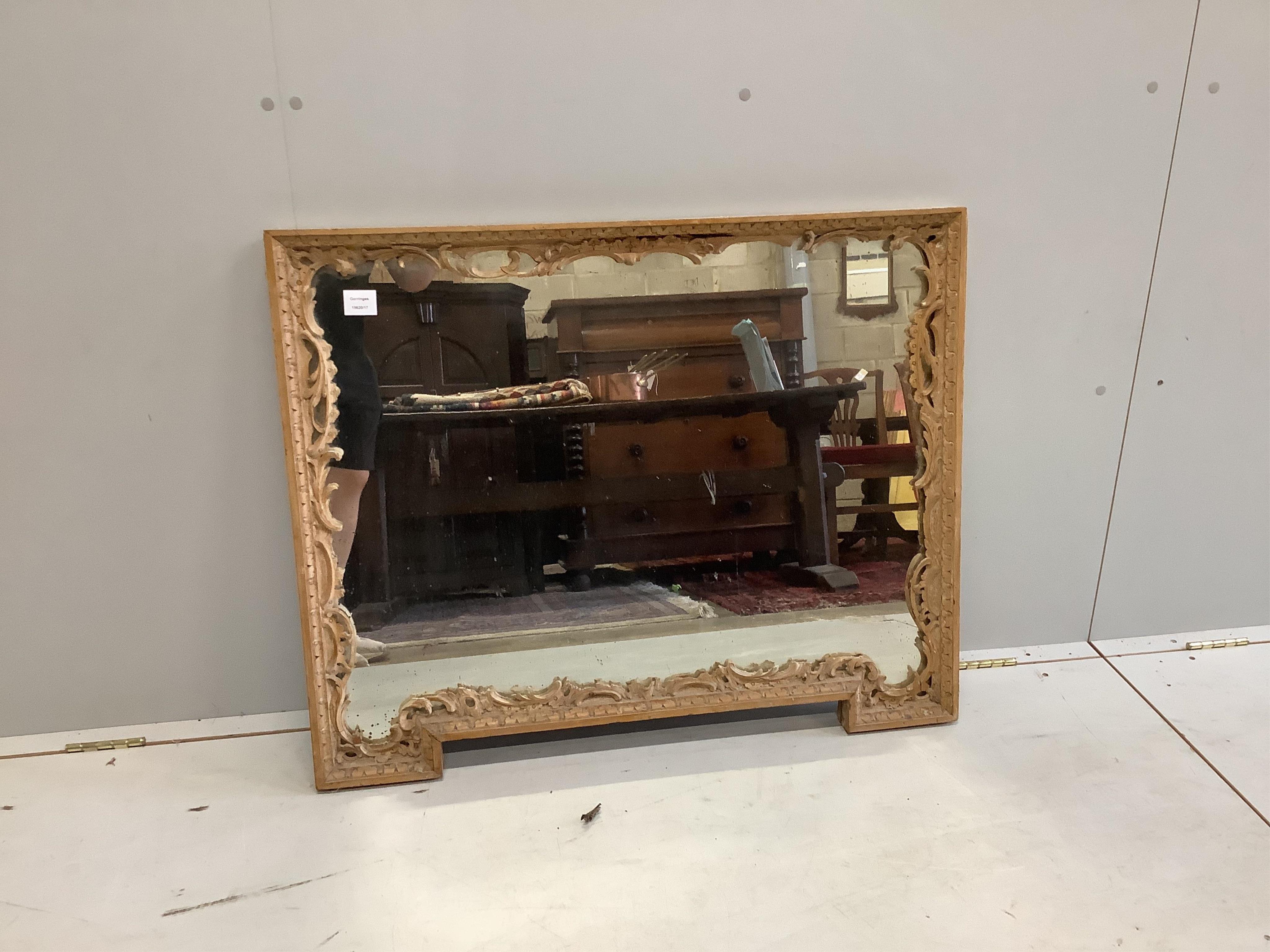 A Continental bleached wood rectangular carved wall mirror, width 93cm, height 75cm. Condition - poor to fair